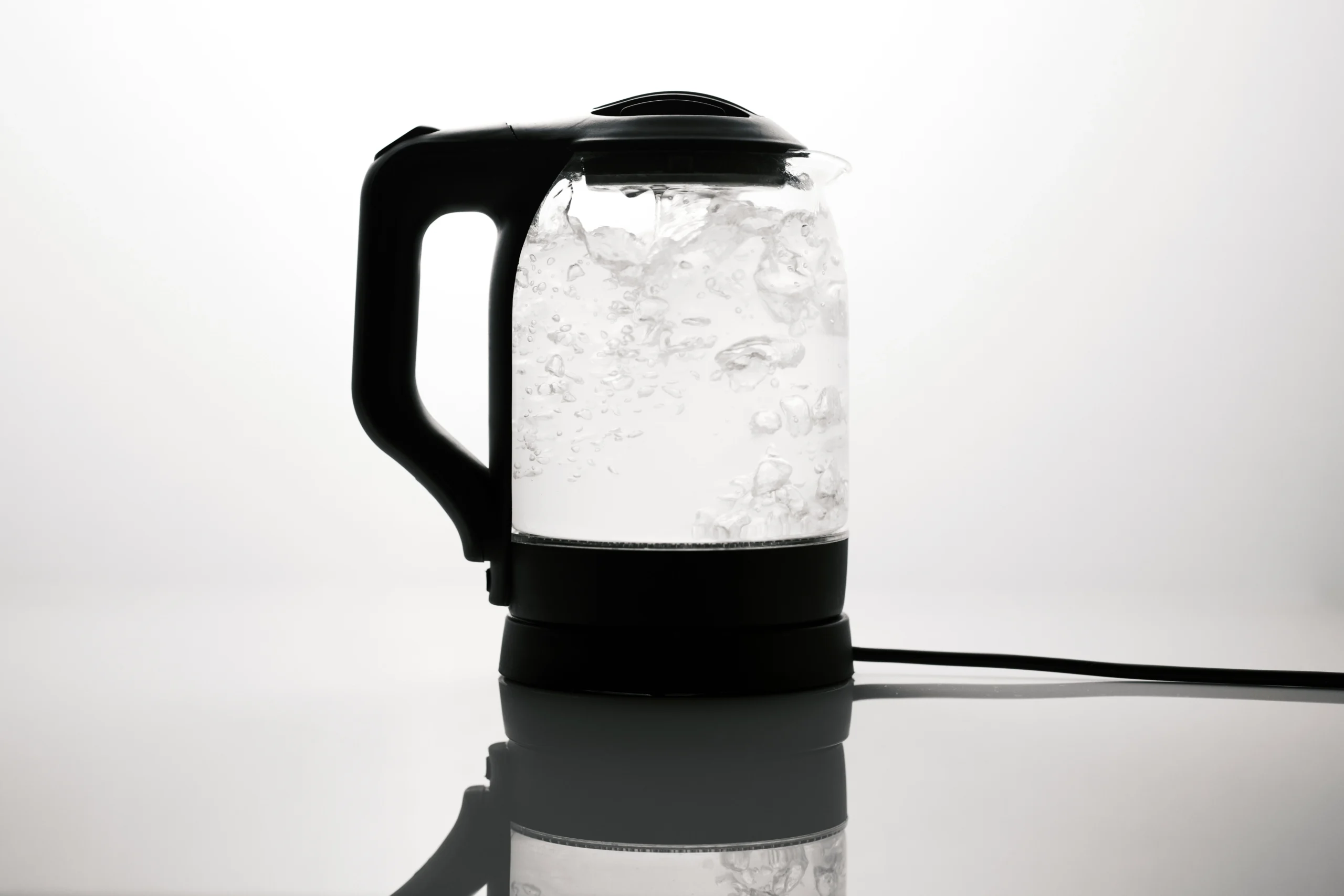 electric kettle boiling water in kitchen