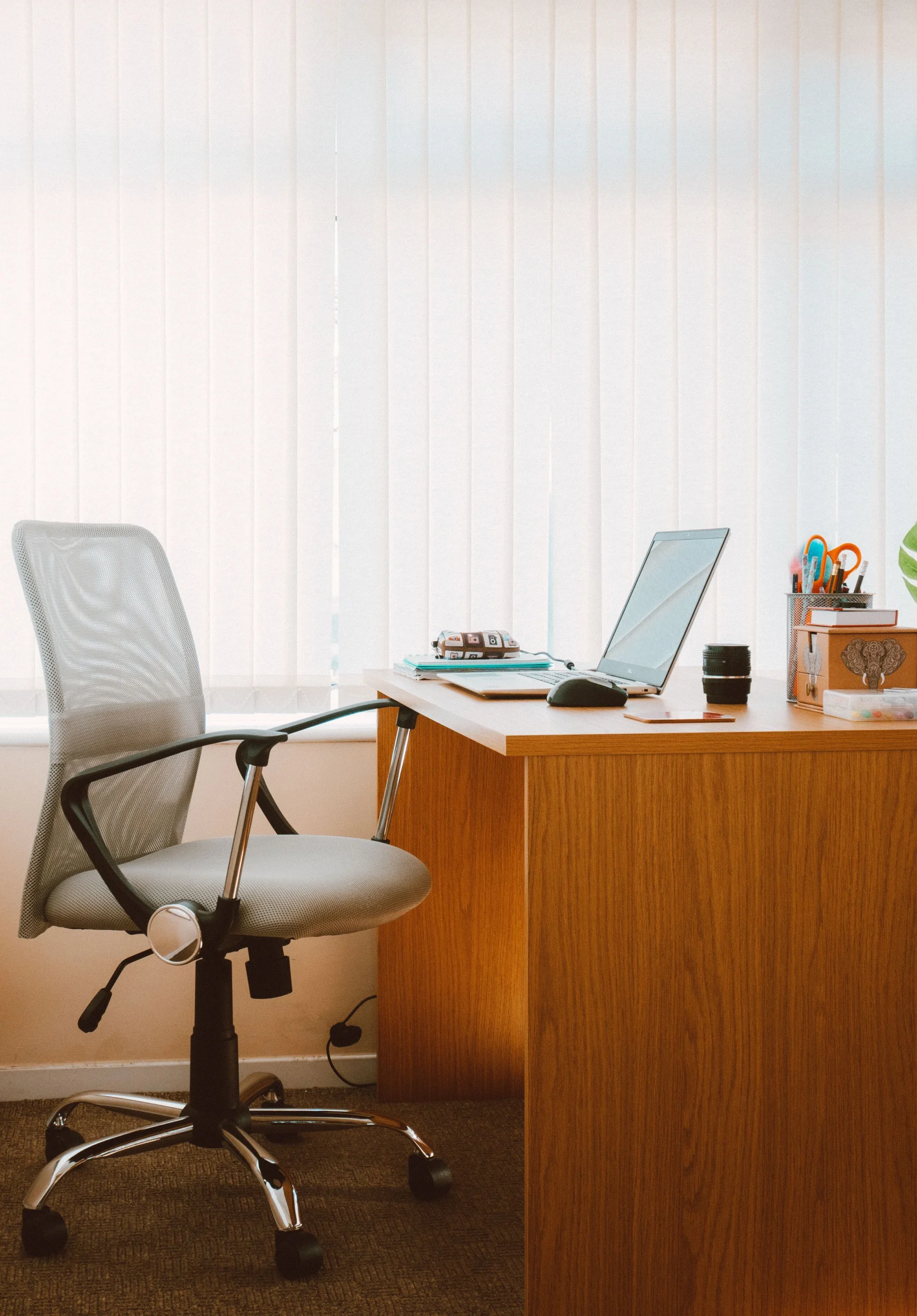 wooden home office desk with ergonomic chair