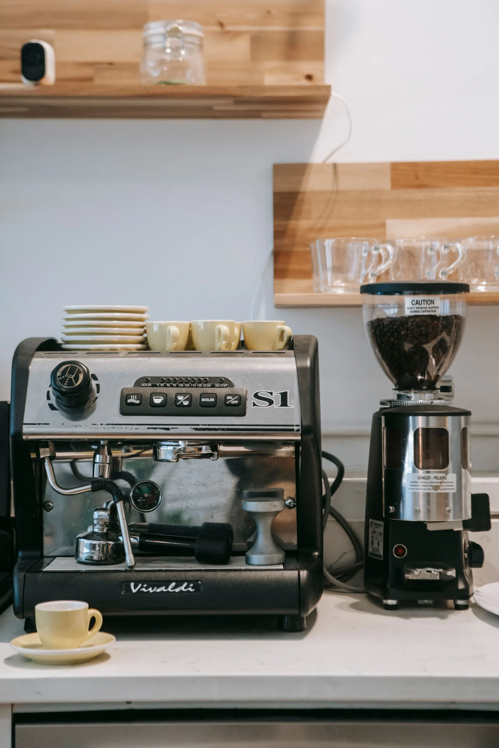 espresso coffee machine and grinder in kitchen