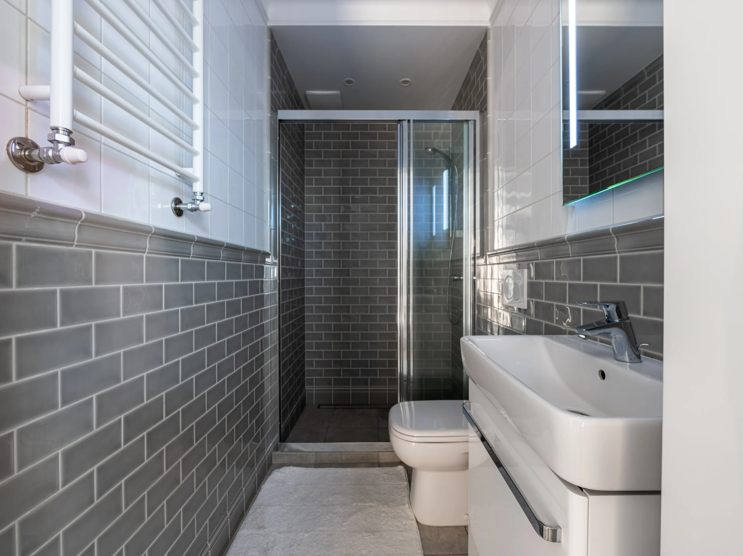 small bathroom with tiled walls and shower